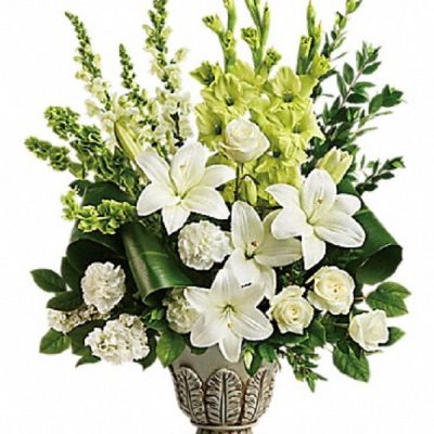 <div class="m-pdp-tabs-description">
<div id="mark-1" class="m-pdp-tabs-marketing-description">Peaceful and majestic in a large antiqued pot, this wondrous white arrangement is a touching tribute to a bright life, and your unending support.</div>
</div>
<p id="arrngDescp">White roses, white asiatic lilies, green gladioli, white carnations, bells of ireland, white snapdragons, and white stock are accented with myrtle, green ti leaves, and lemon leaf.</p>