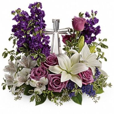 <div class="m-pdp-tabs-description">
<div id="mark-2" class="m-pdp-tabs-marketing-description">A bouquet to remember. This glorious garden of roses, lilies and alstroemeria surrounds a gleaming Crystal Cross. It's a radiant, reverent expression of faith that will be appreciated for years to come.</div>
</div>
<p id="arrngDescp">Lavender roses, white asiatic lilies, white alstroemeria, purple stock and purple seafoam statice are arranged with fresh pitta negra, seeded eucalyptus and lemon leaf. Delivered with a Crystal Cross keepsake.</p>